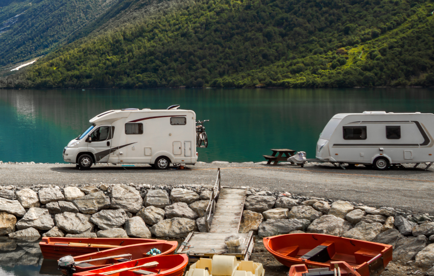 Motorhome and caravan beside a mountain lake